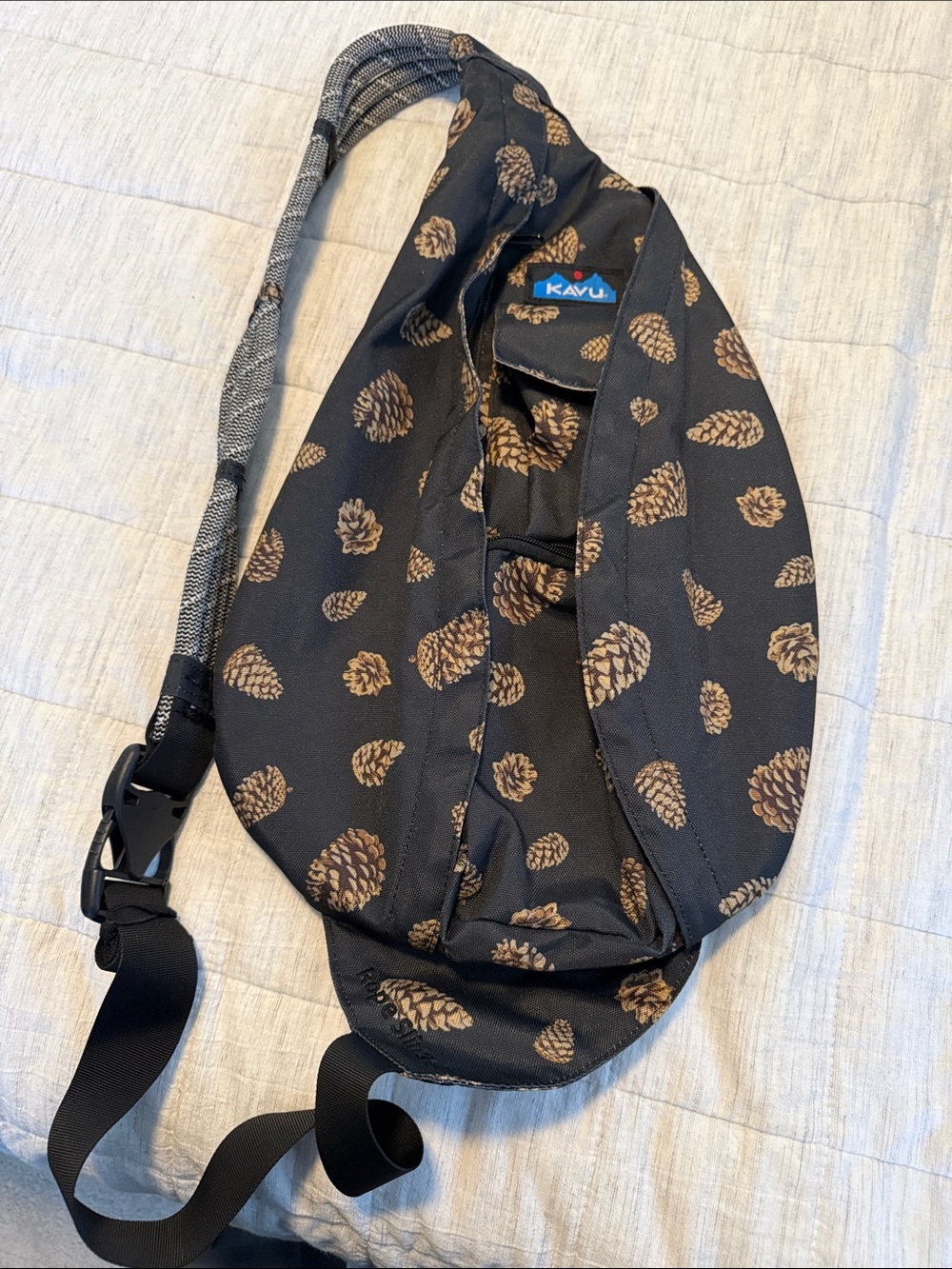 Kavu Black Sling Bag with Brown Pinecone Print